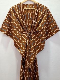 Brown Kaftan Maxi Dress, Gown,Abstract Print Kaftan,Loungewear,Beach Cover Up,Long Caftan,Bridesmaid gift, gifts for her   We give free shipping on the purchase of 130 usd or more on all our products ..Coupon code is   FREESHIPPING   This kaftan is made of pure soft cotton fabric which is lightweight and flowy..The floral pattern is done by hand block printing process  by skilled artisans of Rajasthan using wooden hand carved blocks  Dyes used to print this fabric is natural vegetable dyes Machi Beach Kaftan With Ikat Print And Kimono Sleeves, Ikat Print Kaftan With Kimono Sleeves For Beach, Brown Tunic Kaftan For Vacation, Free Size Brown Kaftan For Beach, Brown Tunic Kaftan For Beach, Brown Free Size Kaftan For Summer, Brown Free Size Dress For The Beach, Brown Free Size Dress For Beach, Brown Free Size Beach Dress