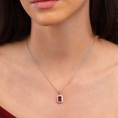 "Features * 925 Sterling Silver elegant halo pendant necklace for women with Red and White AAA cubic zirconia stones * 10mm x 12.5mm rectangle shaped halo pendant for women with 7 mm x 9 mm emerald cut ruby red stone encircled by a halo of smaller 1.5mm white stones on an adjustable 18\" chain, including 2-inch extension links. * Silver halo pendant necklace for women with red and white stones made in rhodium-plated 925 Sterling Silver * All our sterling silver jewellery is Rhodium plated adding Red Pendant Necklace, Red Stone Necklace, Red Rectangle, Red Pendants, White Stones, Ruby Pendant, Pendant For Women, Halo Pendant, Ruby Necklace