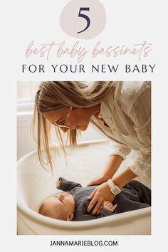 a woman is holding her baby in a cradle with the text 5 best baby essentials for your new baby