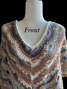 a crocheted sweater is shown on a mannequin headdress with the word front written across it