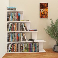 a bookshelf filled with lots of books next to a potted plant on top of a hard wood floor