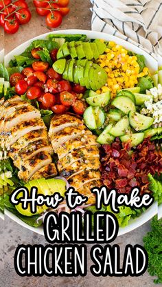 grilled chicken salad with tomatoes, cucumbers and avocado on the side