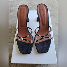 New In Box Size: 37.5 Denim Heeled Sandals In Indigo. Open Square Toe Crystal-Cut Floral Appliqus At Vamp Logo Embossed At Goatskin Footbed Modified Stiletto Heel With Rubber Injection Leather Sole Heel: 70 Mm Upper: Textile Sole: Leather, Rubber. Made In Italy. Retails $1,255 Muaddi Shoes, Amina Muaddi Heels, Pink Sandals Heels, Amina Muaddi Shoes, Glass Heels, Denim Heels, Crystal Heels, Heeled Mules Sandals, Amina Muaddi