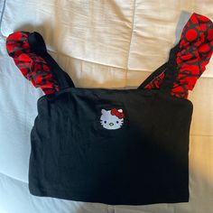 Nwot Hello Kitty Crop Top. Off The Shoulder Frilly Straps. Sold Out Online. I Cut The Tag Out Of The Inside When I Tried It On Because It Was Itchy. Fitted Sleeveless Tops With Cat Print, Fitted Black Hello Kitty Print Top, Fitted Black Hello Kitty Top, Fitted Black Top With Hello Kitty Print, Y2k Black Hello Kitty Print Top, Casual Black Hello Kitty Top, Cute Black Top With Cat Print, Hello Kitty Crop Top, Frilly Tops