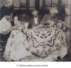 an old black and white photo of four people around a table with crocheted doily on it