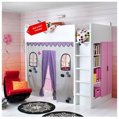 a child's bedroom with pink and white furniture