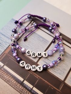 ARMY!!!! I purple you!!!! Army are the best, most kind group of people I've ever come across, so I made us a bracelet to match that energy. Paired with soft rose quartz and as much purple as I could. Available in 2 styles Can be worn on wrist by itself or stacked with other bracelets. Materials: Rose quartz crystal chips Shell beads Assorted glass beads Nylon cord ~Army Spirit~ Army Beaded Bracelet, Beaded Purple Bracelets, Kpop Friendship Bracelets, Bts Friendship Bracelet, Purple Beads Bracelets, Bts Beaded Bracelet, Bts Bracelet Beads, I Purple You, Bts Bracelet Diy