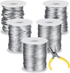 several spools of tinned wire with scissors