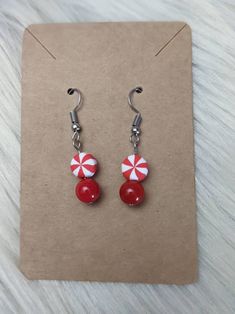 Peppermint Earrings. Christmas Earrings. Holiday Earrings. Winter Earrings. Peppermints. - Etsy Christmas Earrings With Round Beads, Winter Themed Earrings, Peppermint Earrings, Red Holiday Festive Earrings, Candycane Earrings, Winter Earrings, Holiday Earring, Christmas Earrings, Christmas Jewelry