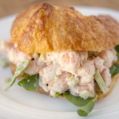 a croissant sandwich with chicken salad on it