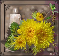 yellow flowers and a lit candle are in front of an ornate frame with the word i'm on it