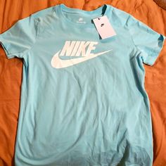 Baby Blue Nike T. Nwt Basic Blue Shirt With Letter Print, Light Blue Basic Tops With Graphic Print, Light Blue Basic Top With Graphic Print, Nike Blue Shirt For Summer, Nike Blue Tops For Spring, Basic Blue Letter Print Shirt, Blue Letter Print Basic Shirt, Basic Blue Spring Shirt, Nike Basic T-shirt For Spring