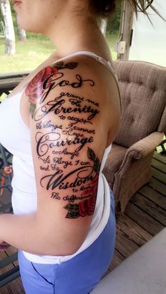 a woman with a tattoo on her arm that has words written in different languages and flowers