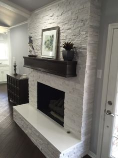 a white brick fireplace in a living room