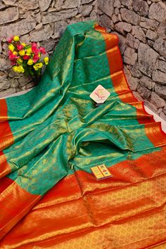 Do you think to buy the best and richness-filled kanjeevaram silk but with a twist element like the brocade? This turquoise green color kanjeevaram silk mark saree comes with brocade work and a broad border to make you party-ready any time. Color: A shade of turquoise green color Technique: This fabric comes with fantastic work of brocade and golden zari on the whole saree Fabric: Kanjeevaram Silk Quality: IndyVogue's Assurance of Silk Mark Certified Green Tussar Silk Saree For Designer Wear, Green Tussar Silk Traditional Wear With Cutdana, Green Handloom Traditional Wear For Designer Occasions, Festive Green Tissue Silk Traditional Wear, Designer Green Saree With Zari Weaving, Green Tissue Silk Traditional Wear For Wedding, Green Tussar Silk Saree With Meenakari, Green Meenakari Tussar Silk Saree, Designer Green Brocade Traditional Wear