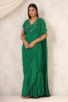 Green pre-draped saree with a delicately embroidered border and frill details on the border and pallu. Paired with a padded embroidered blouse in floral pattern. - Aza Fashions Ruffle Sarees, Draped Saree, Ruffle Saree, Drape Saree, Ruffle Fabric, On The Border, Embroidered Border, Beaded Neckline, Blouse For Women