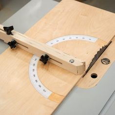 a piece of wood being cut with a circular sawtoother on top of it