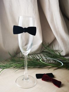 These bow ties are hand-made from velvet ribbon. Clear mounting tapes are attached at the back, making it easy to attach the bow ties to glasses or any hard surfaces. Our mounting strips hold the bows in place perfectly with the right amount of stickiness. They also leave the surface clean without traces when detached. Average size: approx. 2.5 x 7 cm / 1 x 2 ¾ inch (width x length) * Due to the handmade nature, the shape and size of the bow ties may vary slightly. * Each bow tie is made with ca Adjustable Ribbon Bow For Party, Black Bow Tie For Gift, Black Bow Tie As Gift, Black Ribbon Bow For Gifts, Black Bow With Butterfly Knot For Gift, Black Bow With Butterfly Knot As Gift, Black Butterfly Knot Bow As Gift, Elegant Ribbon Bow Tie For Party, Party Bow Ties