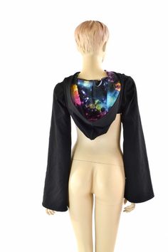 "This item is made to order, please read all the way through the listing before purchasing! This bolero top is made of soft, matte black zen knit. It is breathable and stretchy, with a great weight and drape. The hood is lined in UV glow galaxy print, and the long sleeves have a wide, Bell cut. (Crop tank and cheekies sold separately) We can create these in any color or print shown in the shop. If you do not see what you want, please ask! Womens Sizing (See below for instructions on where measur Rave Style Fitted Top For Cosplay, Fitted Rave Top For Cosplay, Fitted Winter Tops For Cosplay, Black Rave Style Top For Cosplay, Black Rave Top For Cosplay, Sleeve Bolero, Bolero Top, Galaxy Print, Rave Festival