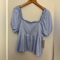 Beautiful Derek Heart Smocked Ruffle Top Short Sleeve. Light Blue. Size 2x. Nwt. Casual Smocked Top With Ruffle Hem For Day Out, Casual Smocked Top With Ruffles, Spring Cotton Smocked Top With Elastic Waistband, Blue Cotton Smocked Top For Brunch, Blue Puff Sleeve Smocked Top With Smocked Cuffs, Light Blue Fitted Smocked Top For Spring, Fitted Light Blue Smocked Top For Spring, Trendy Blue Smocked Top With Ruffles, Blue Stretch Smocked Top For Spring