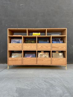 a wooden shelf filled with lots of books