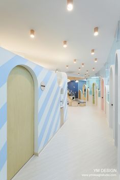 the interior of a children's playroom with blue and white walls