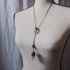 Look effortlessly stylish and access your inner power with this beautiful Quartz Lariat Necklace. Crafted with a unique brass chain, druzy agate slice and a copper electroformed Quartz pendant, this delicate piece will be a timeless addition to your boho wardrobe and enhance your spiritual and physical energy. FEATURES: • beautiful boho style talisman lariat necklace• features an electroformed quartz crystal point • antique brass rolo chain• druzy agate slice THE STONE: • QUARTZ - all chakras • raises energy on all levels - energy amplifier • spiritual wisdom • enhances psychic ability • atunement to spiritual purpose Bohemian Quartz Jewelry With Hand Wrapped Detail, Handmade Adjustable Quartz Necklace, Bohemian Wire Wrapped Quartz Jewelry, Bohemian Hand Wrapped Quartz Jewelry, Hand Wrapped Bohemian Quartz Jewelry, Spiritual Brass Crystal Necklaces For Healing, Bohemian Quartz Jewelry With Raw Stone, Bohemian Jewelry With Raw Quartz Stone, Bohemian Crystal Necklace With Adjustable Chain