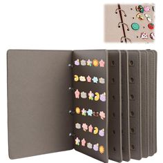 an open binder with lots of buttons on the front and back of it's cover