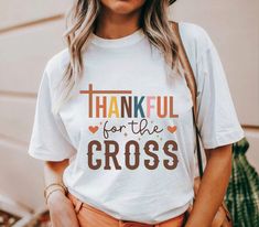 A Thankful Thanksgiving T-shirt that exudes warmth and gratitude, perfect for celebrating the holiday with loved ones. The classic fit and medium fabric ensure year-round comfort, while the tear-away label adds convenience and scratch-free wear. Ideal for anyone looking to add a festive touch to their wardrobe during the Thanksgiving season. Product features - Made from 100% US cotton for sustainability - Classic fit for a comfy and relaxed wear - Tear-away label for scratch-free experience - Et Thankful Shirt Ideas Vinyl, Fall Season T-shirt Gift, Fall Gift T-shirt With Short Sleeves, Short Sleeve T-shirt For Fall Gift, Letter Print T-shirt As Fall Gift, Thanksgiving Cotton T-shirt With Letter Print, Casual Thanksgiving T-shirt With Letter Print, White T-shirt For Fall Season Gift, White T-shirt For Fall Gift