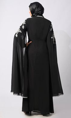 Introducing our latest marvel from the Eid Collection: the epitome of elegance and craftsmanship, our Handwork Abaya. Crafted with meticulous attention to detail, this abaya is a fusion of tradition and contemporary sophistication. Featuring intricate handwork adorning the entire garment, each stitch is a testament to the skill and dedication of our artisans. From delicate katdana embellishments to shimmering stone work, every detail is thoughtfully placed to create a stunning visual masterpiece. Designed for both style and comfort, our Handwork Abaya boasts luxurious satin lining that drapes gracefully against your skin. The batwing sleeves add a touch of drama and flair, while providing ample room for movement and ease of wear. Embrace the spirit of the season with our Eid Collection Aba Black Abaya, Eid Collection, Stone Work, Batwing Sleeve, Bat Wings, Drama, Marvel, Couture, Skin