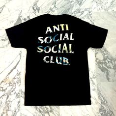 Black Anti Social Social Club T-Shirt With “The Great Wave Off Kanagawa” By Hokusai In The Lettering. Runs True To Size, 100% Cotton. Never Worn. Black T-shirt With Back Print For Summer, Black Shirt With Back Print, Relaxed Fit, Black Urban Shirt With Back Print, Urban Style Black Shirt With Back Print, Black Shirt With Front Print For Summer, Black Cotton Shirt With Back Print, Black Screen Print Shirt For Streetwear, Black Cotton Shirt With Front Print, Black Summer T-shirt With Back Print