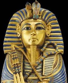 an egyptian statue is shown in gold and blue colors, with the head of pharaoh tutan