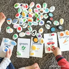 two children are playing with magnets on the floor