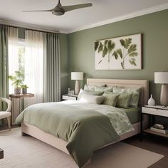 a bedroom with green walls and white furniture