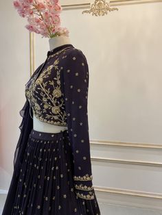 This georgette crepe high-collared crop top with front opening hooks is paired with a georgette crepe butti skirt.  The outfit is completed with a ruffle soft organza dupatta. Crepe Lehenga, Floral Lehenga, Organza Dupatta, The Outfit, Lehenga, Victorian Dress, Crop Top, Crop Tops, Boutique