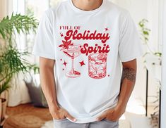 Super cute Full of Holiday Spirit Tee.  Fun shirt for any Christmas function. This tee is perfect alone, under a sweater, denim jacket or kimono.  Super soft Bella Canvas 3001, cotton tee.  You will love the fit and feel of this shirt!  All shirts are unisex sized. (not fitted) Message me if you need a youth or women's sizing. Christmas Party Shirt, Christmas Party Shirts, Fun Shirt, Funny Christmas Shirts, Christmas Tees, Funny Christmas, Christmas Shirt, Christmas Humor, Holiday Spirit