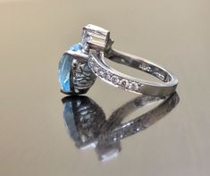 DeKara Designs Latest Creation A Beautiful Unique Platinum Heart Shaped Aquamarine and Diamond Art Deco/Modern Ring. Metal- 90% Platinum, 10% Iridium. Stones- 1 Heart Shaped Natural Aquamarine 7 Carats, 1 Pear Shape Diamond F-G Color VS2 Clarity 0.36 Carats, 16 Round Diamonds F-G Color VS1-VS2 Clarity 0.72 Carats. Beautiful and Timeless Diamond Aquamarine Heart Ring Made in Platinum. The ring features a beautifully cut heart shape aquamarine that is professionally set in between three prongs. Th Heart Cut Multi-stone Diamond Rings, Heart Diamond Ring, Diamond Heart Ring, Heart Diamond, Aquamarine Ring, Modern Ring, Aquamarine Rings, Art Deco Diamond, Pear Shaped Diamond