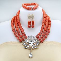 Main Material: Coral  Length: 19Inch ( If you need custom length, please contact with us for the price firstly) Items included: Necklace / Bracelet /Earrings All items are by handmade, it need to takes about 3-5 days to make it . Celebrate your special day with our exquisite luxury African wedding jewelry set. Coral Round Beads Necklaces For Wedding, Coral Round Bead Necklaces For Weddings, Coral Round Beads Necklace For Wedding, Elegant Coral Beads For Wedding, Coral Beaded Necklaces For Wedding, Elegant Orange Beads For Wedding, Elegant Orange Beaded Necklace For Wedding, Elegant Coral Necklace For Weddings, Elegant Orange Wedding Beads