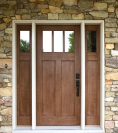 the front door is made of wood and has two sidelights on each side,