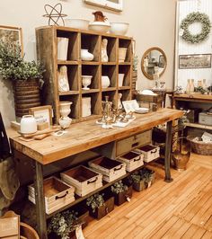 a room filled with lots of different types of furniture and decor on top of wooden shelves