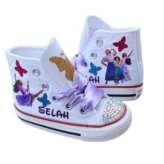 Her name in glittery purple, lavender satin laces, sparkly butterflies in turquoise, gold, and hot pink. She will love these shoes! Purple Canvas Shoes With Rubber Sole And Round Toe, Purple Canvas Shoes With Round Toe And Rubber Sole, Custom Sneakers With White Sole And Rubber Toe Cap, Personalized Shoes, Purple Lavender, High Top Shoes, Sneakers Athletic, High Top, Top Sneakers