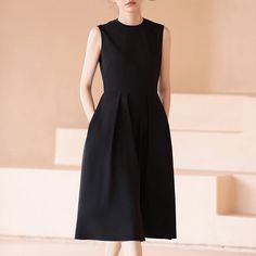 A sleeveless dress with a gently flared hem that gives you the look of a movie actress. This item is sewn high at the waist and creates a beautiful silhouette. Wear it with a cardigan or jacket for all seasons. 
 
 
 
 
 
 
 
 
 
 
 
 
 
 
 
 Size 
 
 
 S size 
 
 
 Length: 110cm 
 Shoulder width: 36cm 
 Bust: 85cm 
 Waist: 68cm 
 
 M size 
 
 Length: 111.5cm 
 Shoulder width: 37cm 
 Bust: 89cm 
 Waist: 72cm 
 
 L size 
 
 Length: 113cm 
 Shoulder width: 38cm 
 Bust: 93cm 
 Waist: 76cm 
 
 XL si Chic A-line Tea Length Dress With Pleated Bodice, Elegant Sleeveless A-line Fit And Flare Dress, Elegant A-line Fit And Flare Sleeveless Dress, Chic A-line Sleeveless Dress With Box Pleat, Flattering A-line Sleeveless Dress For Work, Spring Sleeveless A-line Dress With Pleated Back, A-line Sleeveless Dress With Pleated Hem For Spring, Elegant A-line Sleeveless Dress With Pleated Hem, Chic Dresses With Box Pleat Full Skirt