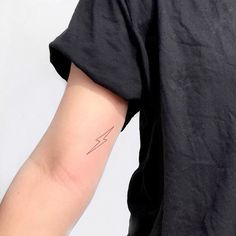 a person with a small tattoo on their arm