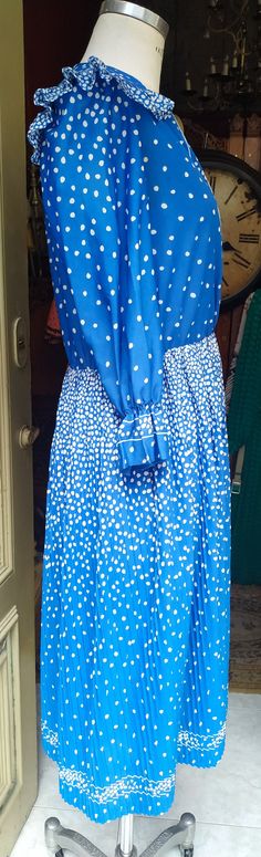 "Welcome! This is 80s Vintage Pleated and ruffled Dress In very good condition, this blue dress has a lot of details Smoke Free Made in France Not lining Size M Measures: - Shoulder to shoulder: 14.56\" (37 cm) - Slevees: 19.68\" (50 cm) - Chest: 39.37\" (100 cm) - Total Long: 44.09\" (112 cm) Thanks for stopping by!IMPORTANT: Due to the delicate situation We're all going through, and in order to keep the safety of courier workers too, all orders will be dispatched when alert sanitary finished. Retro Blue Midi Dress For Spring, Blue Retro Midi Dress For Spring, Blue Long Sleeve Vintage Dress For Summer, Vintage Blue Midi Dress For Spring, Blue Vintage Midi Dress For Spring, Blue Retro Midi Length Vintage Dress, Blue Retro Midi Vintage Dress, Retro Blue Midi Vintage Dress, Retro Blue Vintage Dress For Spring