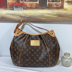 Gently Used, Good Condition, Clean Too :) Description Fit All Your Essentials In This Versatile Louis Vuitton Bag. The Price Of This Bag Will Only Increase. Color: Brown And Tan Approx Measurement : 18” X 13” X 6.5” Inches Strap Drop: 9” From The 2008 Collection Brass Hardware Tan Vachetta Leather Trim Logo Placard At Front Face Protective Feet At Base Beige Alcantara Lining Three Interior Pockets; One With Snap Closure At Flap And Magnetic Snap Closure At Top. Suggested Retail: Us$1460 In 2008, Brown Signature Coated Canvas Shoulder Bag With Gold-tone Hardware, Monogram Canvas Shoulder Bag With Gold-tone Hardware For Errands, Luxury Brown Shoulder Bag For Errands, Everyday Monogram Canvas Shoulder Bag With Branded Hardware, Designer Brown Shoulder Bag In Signature Coated Canvas, Designer Everyday Shoulder Bag In Signature Coated Canvas, Designer Shoulder Bag In Signature Coated Canvas For Everyday, Designer Brown Monogram Canvas Shoulder Bag, Tan Monogram Canvas Shoulder Bag For Errands