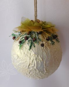 an ornament hanging from a rope on a wall