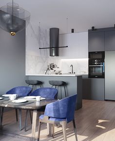 a kitchen with blue chairs and a table in the foreground, an oven on the far wall