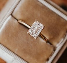 an engagement ring with a baguette cut diamond