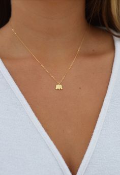 "Tiny Elephant Necklace, Baby Animal Necklace, Mini Elephant, Elephant Gifts, Dainty Elephant Necklace, Tiny Gold Necklace, Elephant Charm ♥Elephants are a symbol of prosperity, good luck & success. Makes a great gift for anyone in your life ♥This necklace is my new favorite! Wear it alone or great for layering! ♥A delicate 14k gold filled, rose gold filled or sterling silver chain, with a hint of shimmer. Adorned with a dainty gold vermeil, rose gold or sterling silver elephant charm. Finished Dainty 16 Inch Charm Necklace As A Gift, Dainty 16 Inch Charm Necklace For Gift, Tiny Rose Gold Charm Necklace For Gift, Dainty Charm Necklace As Gift, 16 Inch Length, Elephant Necklace Gold Indian, Tiny Gold Necklace, Elephant Locket Gold, Elephant Inspired Jewellery, Elephant Necklace Gold