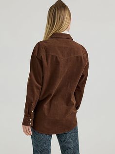 When cooler weather’s here to stay, you’ll want to wear our Women’s Corduroy Boyfriend Shirt every day. Offering a feminine take on the classic but looser look, this long-sleeve collared shirt is perfect for fall layering. It’s crafted for comfort from a soft corduroy fabric and finished with all the iconic Wrangler® details: Western-inspired yokes from front to back, chest pockets with flaps and the signature “W” embroidery, as well as a full pearl snap closure. Winter Corduroy Tops, Wrangler Women, Fall Layering, Fall Layers, Corduroy Fabric, Boyfriend Shirt, Cooler Weather, Collared Shirt, Women's Tops